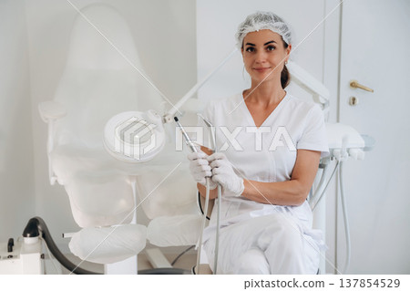 Ready for work. Podiatrist is in the clinic with equipment Ready for work. Podiatrist is in the clinic with equipment 137854529