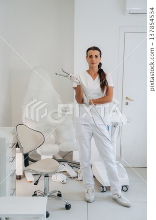 Holding equipment for peeling. Podiatrist is in the clinic with equipment Holding equipment for peeling. Podiatrist is in the clinic with equipment 137854534