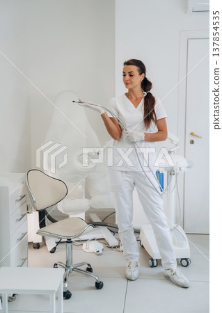 Holding equipment for peeling. Podiatrist is in the clinic with equipment Holding equipment for peeling. Podiatrist is in the clinic with equipment 137854535