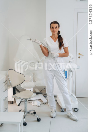 Holding equipment for peeling. Podiatrist is in the clinic with equipment 137854536
