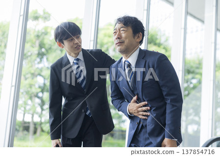 Businessman with poor physical condition Businessman with poor physical condition 137854716