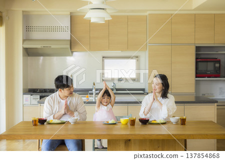 A happy family at the dinner table A happy family at the dinner table 137854868
