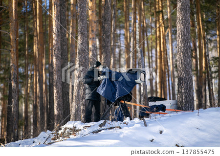 TV cameraman filming snowboard cross competition 137855475