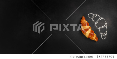 Croissant with chalk sketch on dark background with copy space 137855794