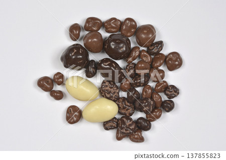 Assorted Chocolate Dragees on a White Background Assorted Chocolate Dragees on a White Background 137855823