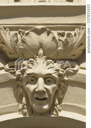 Ornamental mascaron architectural detail on a historic building 137855835