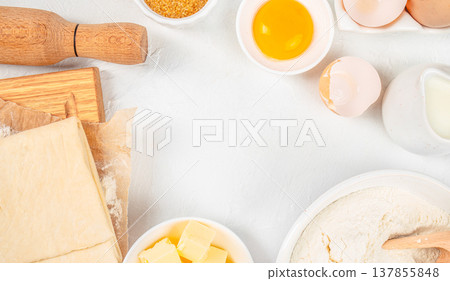 Puff Pastry Dough with Baking Ingredients on White Background Puff Pastry Dough with Baking Ingredients on White Background 137855848