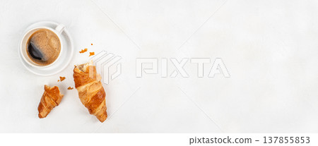 Croissant Pieces with Coffee Cup on White Background Croissant Pieces with Coffee Cup on White Background 137855853