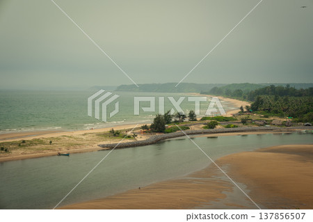 Redi Fort in Goa, India. Beautiful beach near the Indian ocean Redi Fort in Goa, India. Beautiful beach near the Indian ocean 137856507