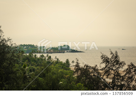 Redi Fort in Goa, India. Beautiful beach near the Indian ocean Redi Fort in Goa, India. Beautiful beach near the Indian ocean 137856509