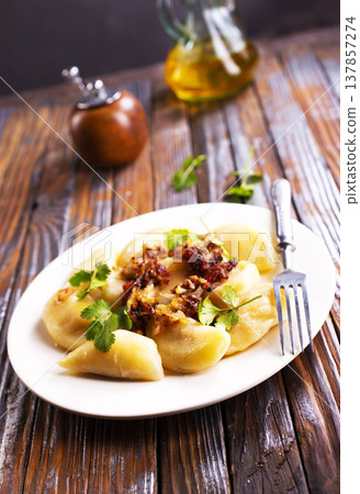 closeup of traditional ukrainian food - dumplings varenik closeup of traditional ukrainian food - dumplings varenik 137857274