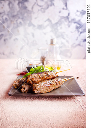 kebab with greens and sauce 137857301