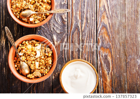 Homemade granola with white sauce Homemade granola with white sauce 137857323
