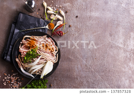 Fresh Raw Beef Minced Meat with herbs and onion 137857328