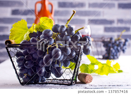 Black grapes on light table 137857416
