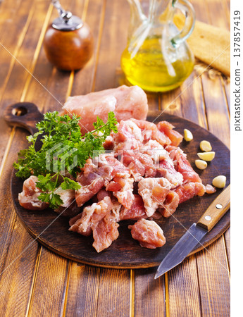 raw meat with spice on wooden board raw meat with spice on wooden board 137857419