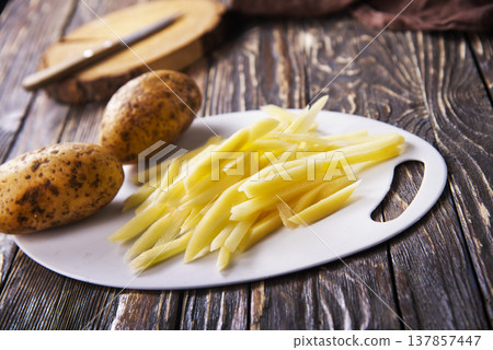 Closeup view of raw French fries. 137857447