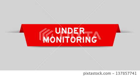 Red color inserted label with word under monitoring on gray background Red color inserted label with word under monitoring on gray background 137857741