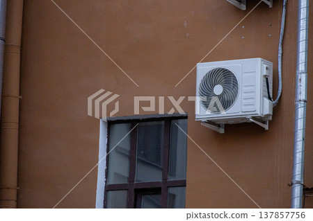 air conditioning on facade of building, air cooling in hot weather.  137857756
