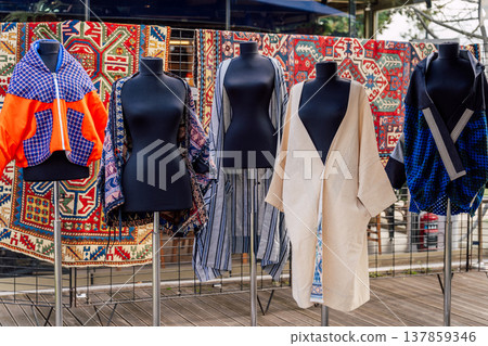 Eccentric Clothing And Textile Showcase. Vibrant Assortment Of Handcrafted Fashion And Textiles Eccentric Clothing And Textile Showcase. Vibrant Assortment Of Handcrafted Fashion And Textiles 137859346