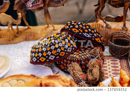 Detailed Scene Of Handstitched Embroidered Hats Amid Artisanal Crafts And Baked Goods Detailed Scene Of Handstitched Embroidered Hats Amid Artisanal Crafts And Baked Goods 137859352
