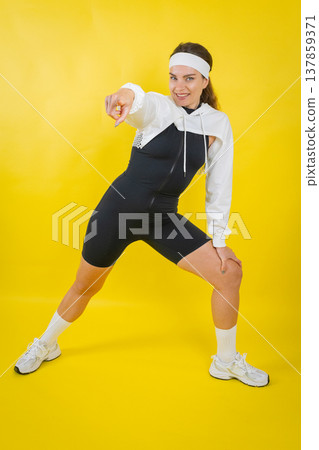 Confident woman pointing finger exercising fitness workout 137859371