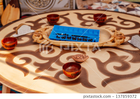 Crafted Cultural Table. Rustic Wooden Surface Showcasing Cultural Crafts And Leisure Items Crafted Cultural Table. Rustic Wooden Surface Showcasing Cultural Crafts And Leisure Items 137859372