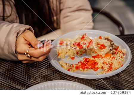 Moment Capturing Inexpensive Urban Lunch With Spicy Rice And Meticulously Manicured Nails 137859384