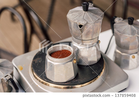 Casual Morning Coffee Ritual Outdoors. Relaxed Backyard Setup With Coffee And Rustic Elements Casual Morning Coffee Ritual Outdoors. Relaxed Backyard Setup With Coffee And Rustic Elements 137859408