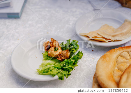 Savor Flavorful Crispy Fried And Steamed Dumplings Elegantly Displayed With Fresh Herbs 137859412