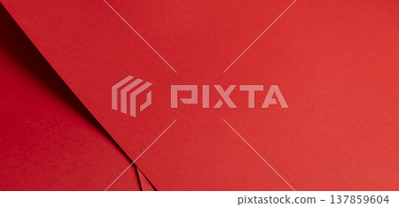 Fiery coral red planes slice diagonally to create a bold dynamic background. Smooth matte paper Fiery coral red planes slice diagonally to create a bold dynamic background. Smooth matte paper 137859604