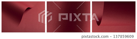 Flowing red surface, paper texture background. Matte burgundy material reveals woven grain with 137859609