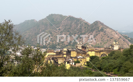 Panoramic view of Amber Fort complex set against the Aravalli hills near Jaipur. Historic Indian Panoramic view of Amber Fort complex set against the Aravalli hills near Jaipur. Historic Indian 137859667