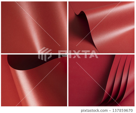 Pleated metallic red paper forms a sculptural backdrop with flowing curves. Glossy satin surface Pleated metallic red paper forms a sculptural backdrop with flowing curves. Glossy satin surface 137859670