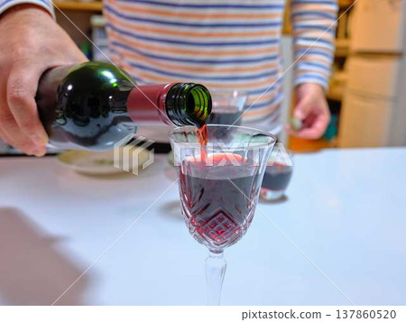 man pouring wine 137860520
