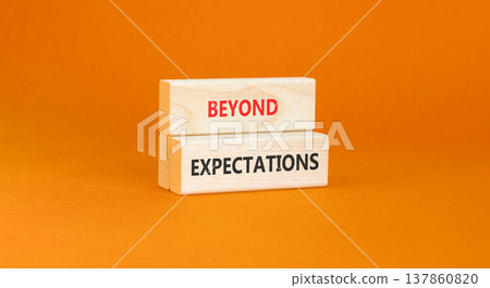 Beyond expectations words symbol. Concept words Beyond expectations on beautiful wooden blocks. Beautiful orange background. Business and Beyond expectations words concept. Copy space. Beyond expectations words symbol. Concept words Beyond expectations on beautiful wooden blocks. Beautiful orange background. Business and Beyond expectations words concept. Copy space. 137860820