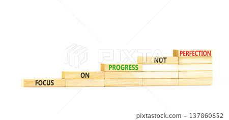 Progress or perfection words symbol. Concept words Focus on progress not perfection on beautiful wooden blocks. Beautiful white paper background. Business progress or perfection concept. Copy space. Progress or perfection words symbol. Concept words Focus on progress not perfection on beautiful wooden blocks. Beautiful white paper background. Business progress or perfection concept. Copy space. 137860852
