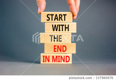 Start with the end in mind symbol. Concept words Start with the end in mind on beautiful wooden blocks. Beautiful grey paper background. Business start with the end in mind concept. Copy space. 137860876
