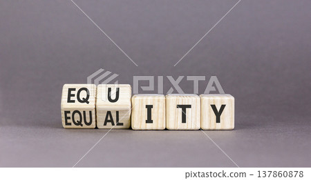 Equity and equality symbol. Concept words Equality to Equity on beautiful wooden cubes. Beautiful grey table grey background. Business, equity and equality concept. Copy space. Equity and equality symbol. Concept words Equality to Equity on beautiful wooden cubes. Beautiful grey table grey background. Business, equity and equality concept. Copy space. 137860878