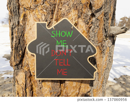 Tell or show symbol. Concept words Show me, do not tell me on beautiful black blackboard. Beautiful old pine tree background. Business tell or show concept. Copy space. Tell or show symbol. Concept words Show me, do not tell me on beautiful black blackboard. Beautiful old pine tree background. Business tell or show concept. Copy space. 137860956