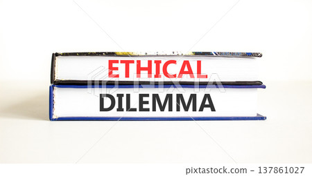 Ethical dilemma words symbol. Concept words Ethical dilemma on beautiful books. Beautiful white background. Business and Ethical dilemma words concept. Copy space. 137861027