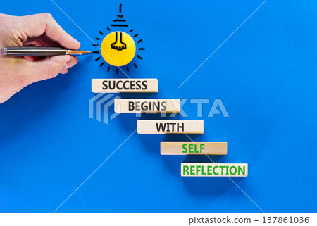 Self reflection symbol. Concept words Success begins with self reflection on beautiful wooden blocks. Beautiful blue background. Business success begins with self reflection concept. Copy space. Self reflection symbol. Concept words Success begins with self reflection on beautiful wooden blocks. Beautiful blue background. Business success begins with self reflection concept. Copy space. 137861036