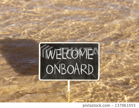 Welcome onboard symbol. Concept words Welcome onboard on beautiful black blackboard. Beautiful Red sea water background. Business, motivational welcome onboard concept. Copy space. 137861055