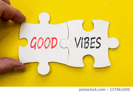Good vibes words symbol. Concept words Good vibes on beautiful white puzzles. Beautiful yellow background. Businessman hand. Business lifestyle and Good vibes words concept. Copy space. 137861099