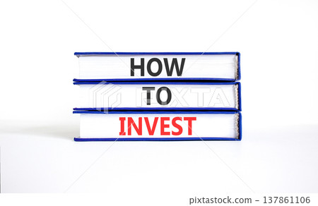 How to invest words symbol. Concept words How to invest on beautiful books. Beautiful white table white background. Business and how to invest concept. Copy space. How to invest words symbol. Concept words How to invest on beautiful books. Beautiful white table white background. Business and how to invest concept. Copy space. 137861106