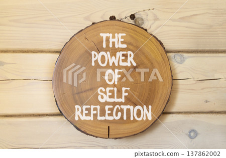 Self reflection symbol. Concept words The power of self reflection on beautiful wooden circle. Beautiful wooden background. Business the power of self reflection concept. Copy space. Self reflection symbol. Concept words The power of self reflection on beautiful wooden circle. Beautiful wooden background. Business the power of self reflection concept. Copy space. 137862002