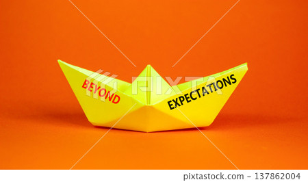 Beyond expectations words symbol. Concept words Beyond expectations on beautiful yellow paper boat. Beautiful orange background. Business and Beyond expectations words concept. Copy space. 137862004