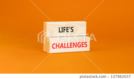 Life's challenges words symbol. Concept words Life's challenges on beautiful wooden blocks. Beautiful orange background. Business lifestyle and Life's challenges words concept. Copy space. 137862037