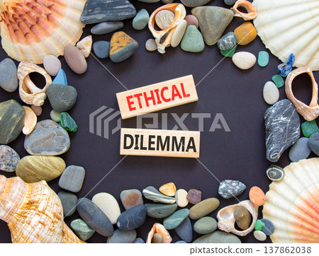 Ethical dilemma words symbol. Concept words Ethical dilemma on beautiful wooden blocks. Beautiful black background. Sea stones sea shells. Business and Ethical dilemma words concept. Copy space. Ethical dilemma words symbol. Concept words Ethical dilemma on beautiful wooden blocks. Beautiful black background. Sea stones sea shells. Business and Ethical dilemma words concept. Copy space. 137862038