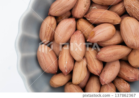 Close-up of peanuts placed on a white background (with space for copying) Close-up of peanuts placed on a white background (with space for copying) 137862367
